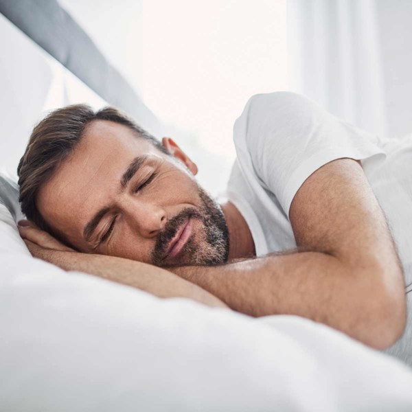 Image of someone asleep in bed.