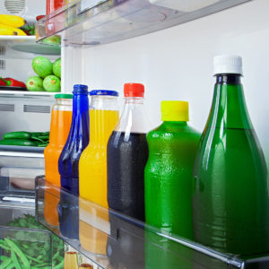 Different types of juices chilling in the fridge