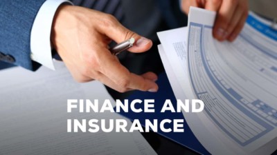 Image of someone flipping through pages in a folder, with the words 'Finance and Insurance' over top the image.