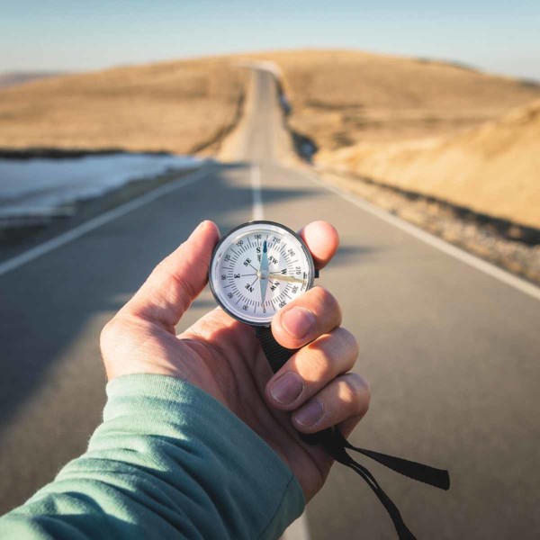 Image of someone holding a compass