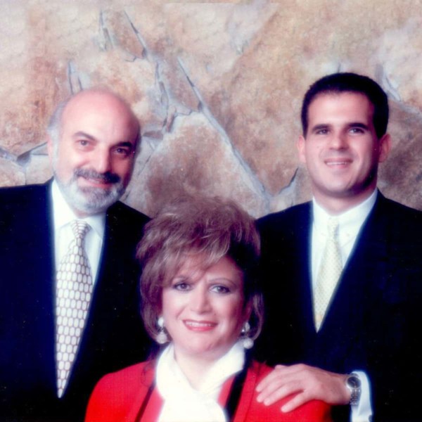 Image of a younger Marcus Lemonis with his parents.