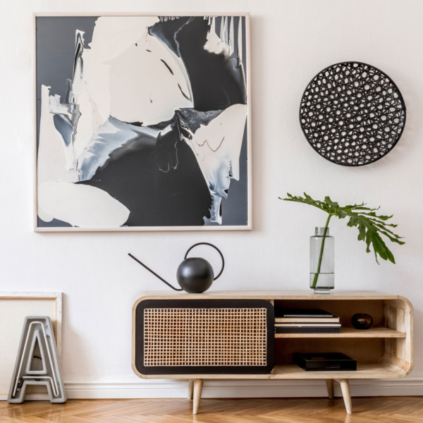tv console and modern wall decor and a really cool round teapot