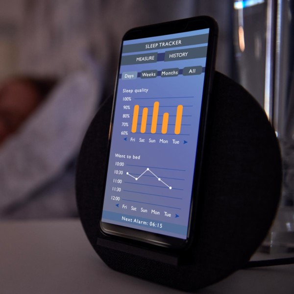Image of a phone with a sleep tracker app on screen.