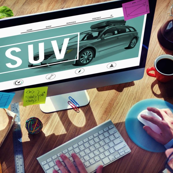 Image of someone looking at a website for an SUV.
