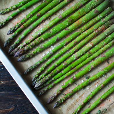 Image of asparagus laid out on a sheet pan