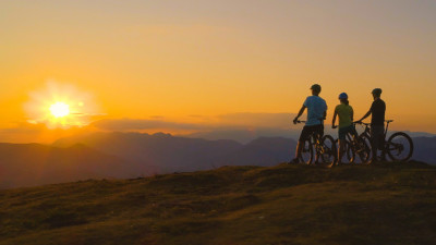 Three bikers overlooking the sunset to maintain their friendship