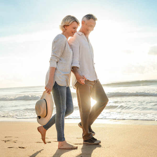 Image of an older couple on date at the beach.