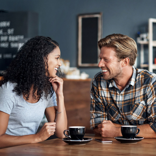 couple enjoying first date in coffee shop