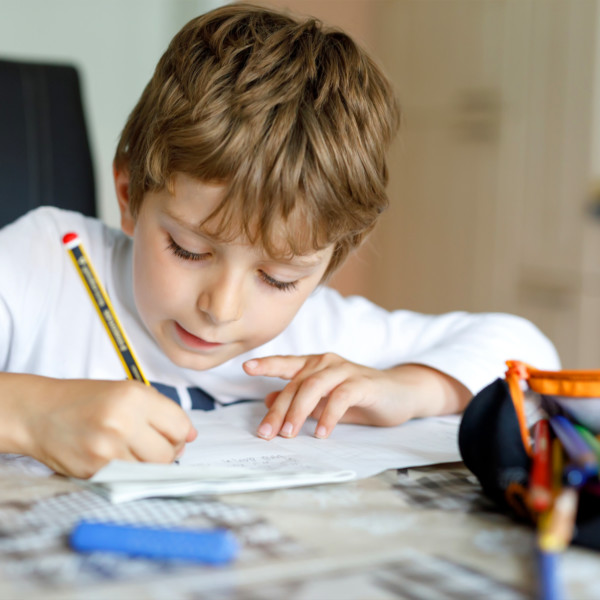 Image of a kid doing homework.