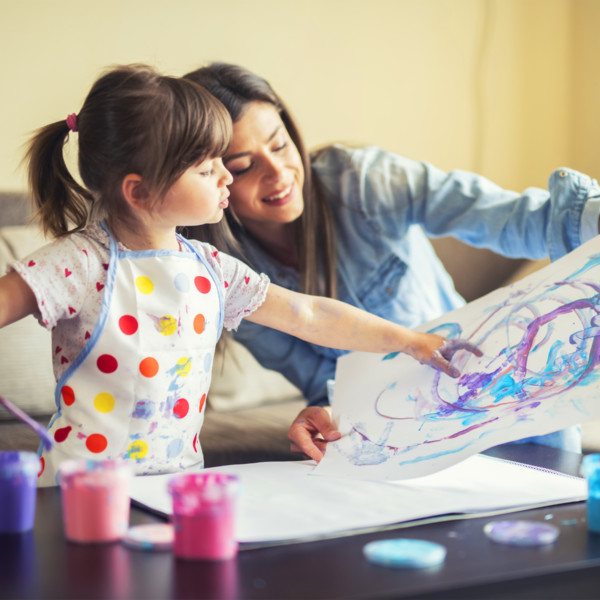 Image of a mother and daughter painting together.