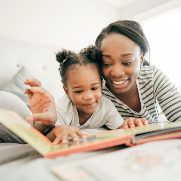 Image of a mother and daughter reading together.