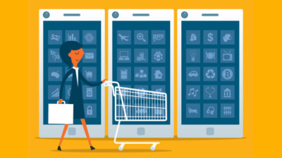 Image of someone pushing a shopping cart in front large phones.