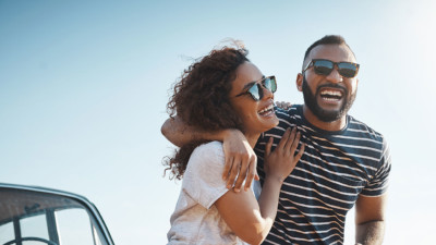 Image of two people wearing sunglasses on a date.