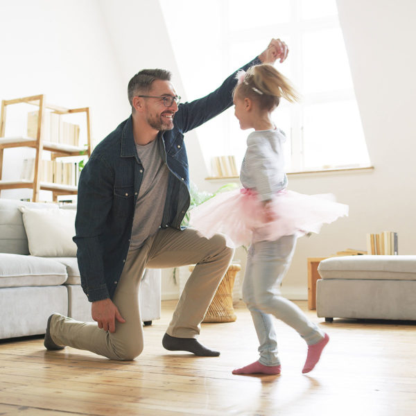 Image of a dad playing with his daughter