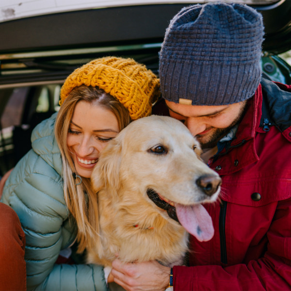 couple with dog enjoying their relationship