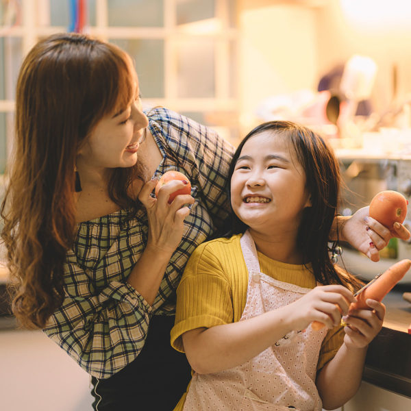 Image of a mother and daughter cooking together