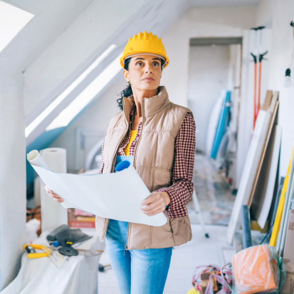 Image of woman wearing hard hat during home construction