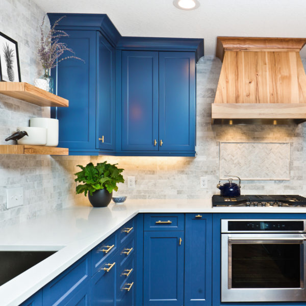Image of a kitchen with blue cabinets.