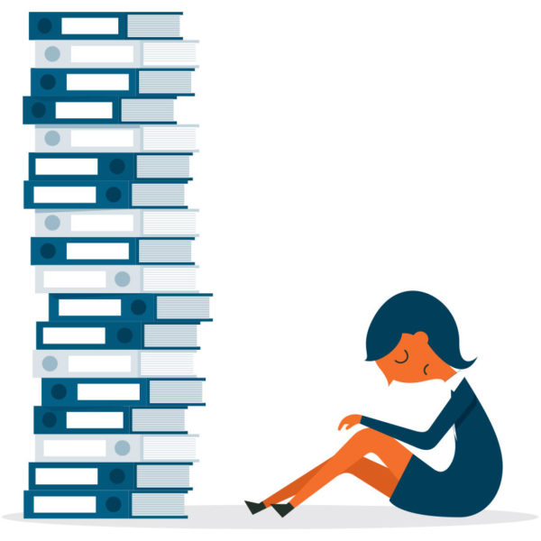 image of sad woman in front of a stack of books