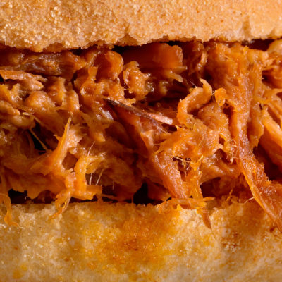 Close up image of a pulled pork sandwich